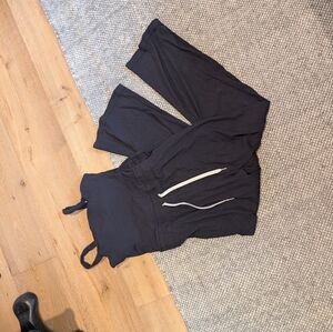 Vuori Mudra Jumpsuit Women's Ribbed Drawstring Pockets Athleisure Black NWT Pose